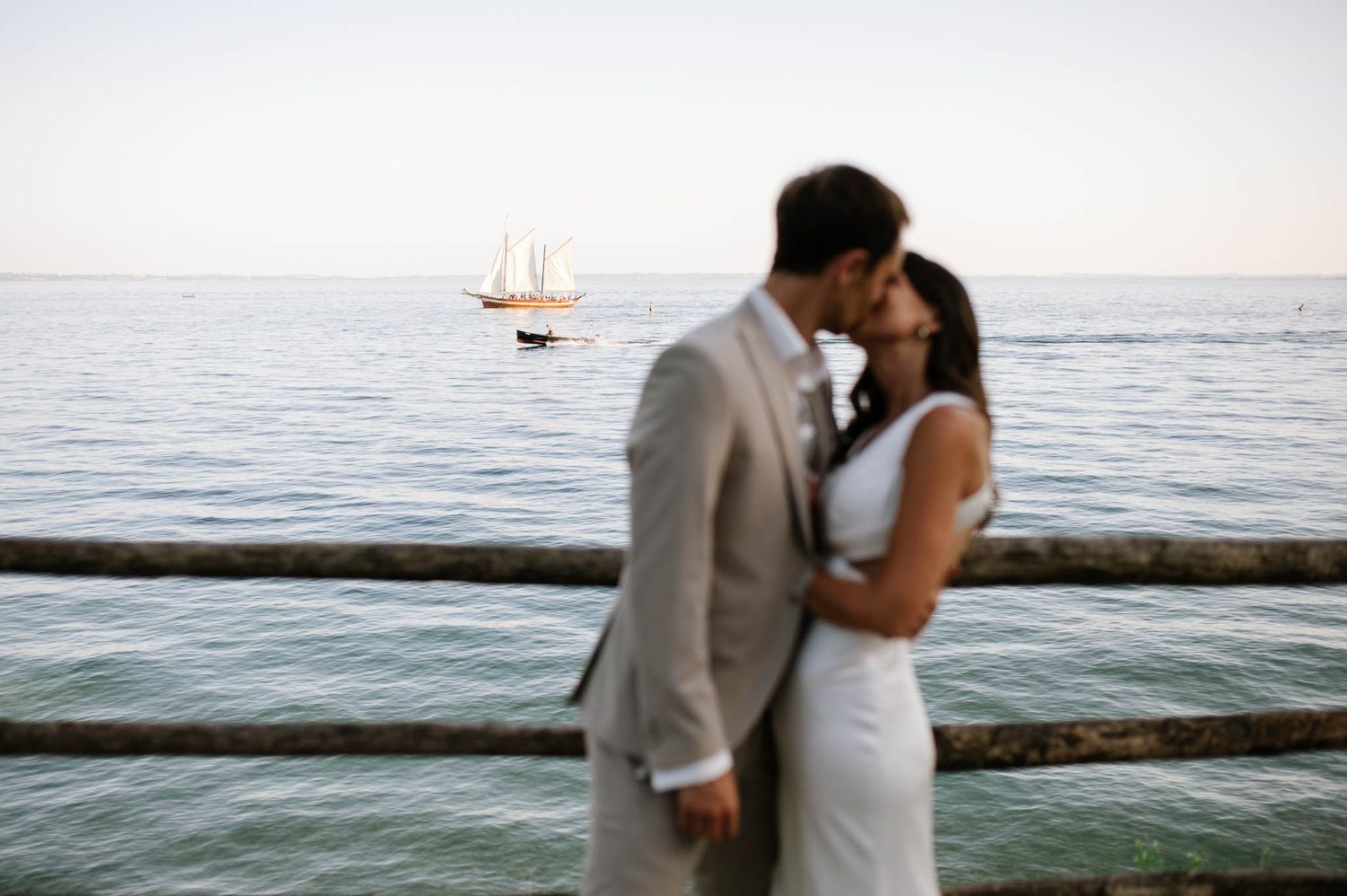 Bride and groom embracing during sunset on Lake Garda - Torri del Benaco, Italy