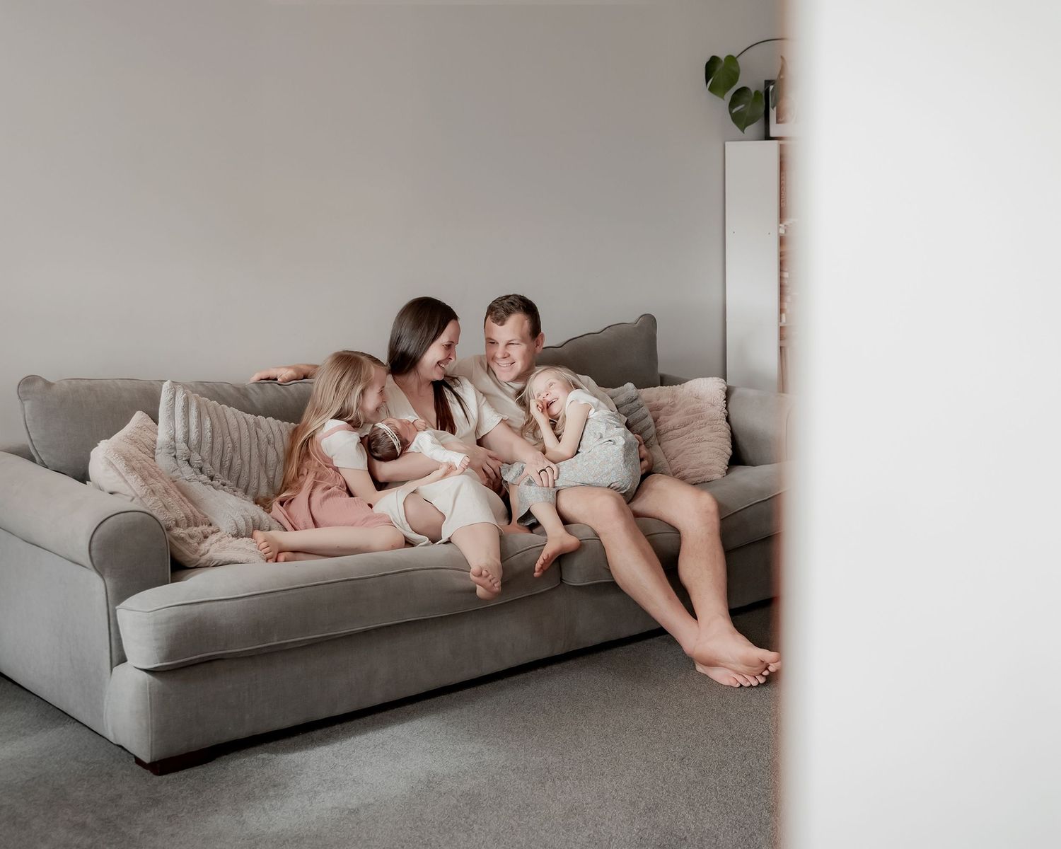 Family welcoming their newborn baby through photography