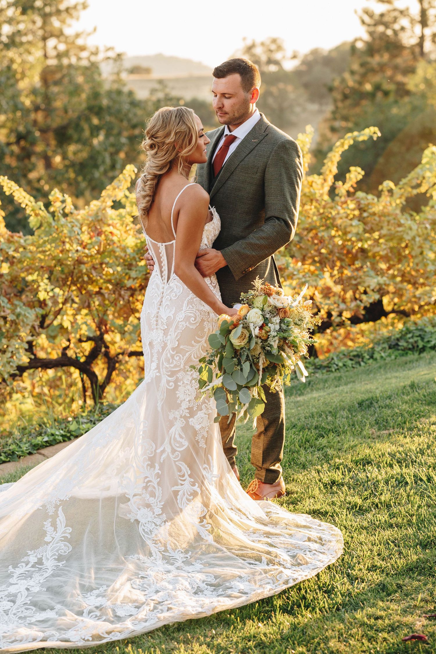 Bride and groom in field  | Breanna Watts Photography