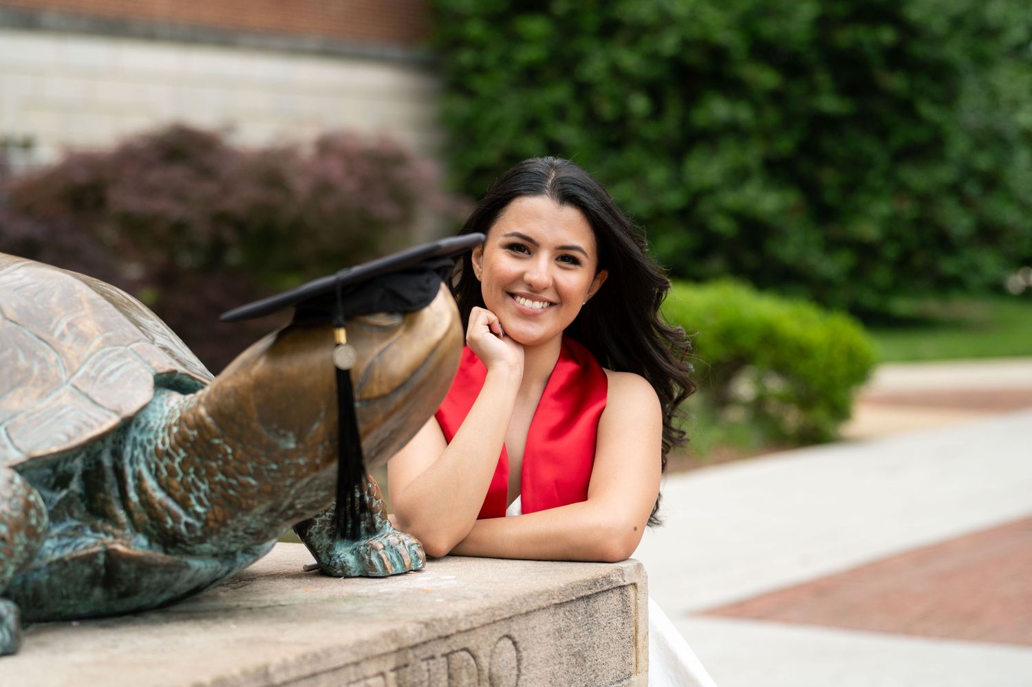 Casual outdoor portrait session near brick architecture.