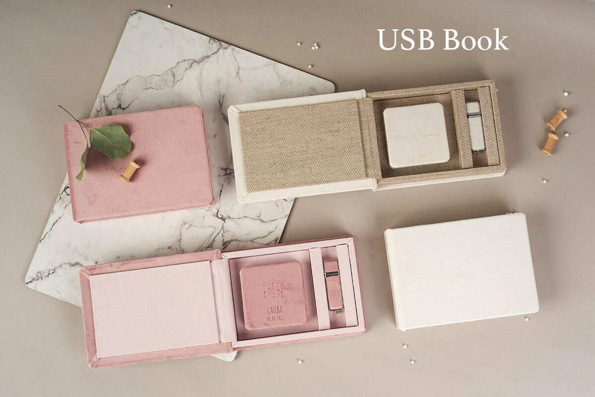 Elegant pink and beige USB book packaging with marble background displaying photography products.
