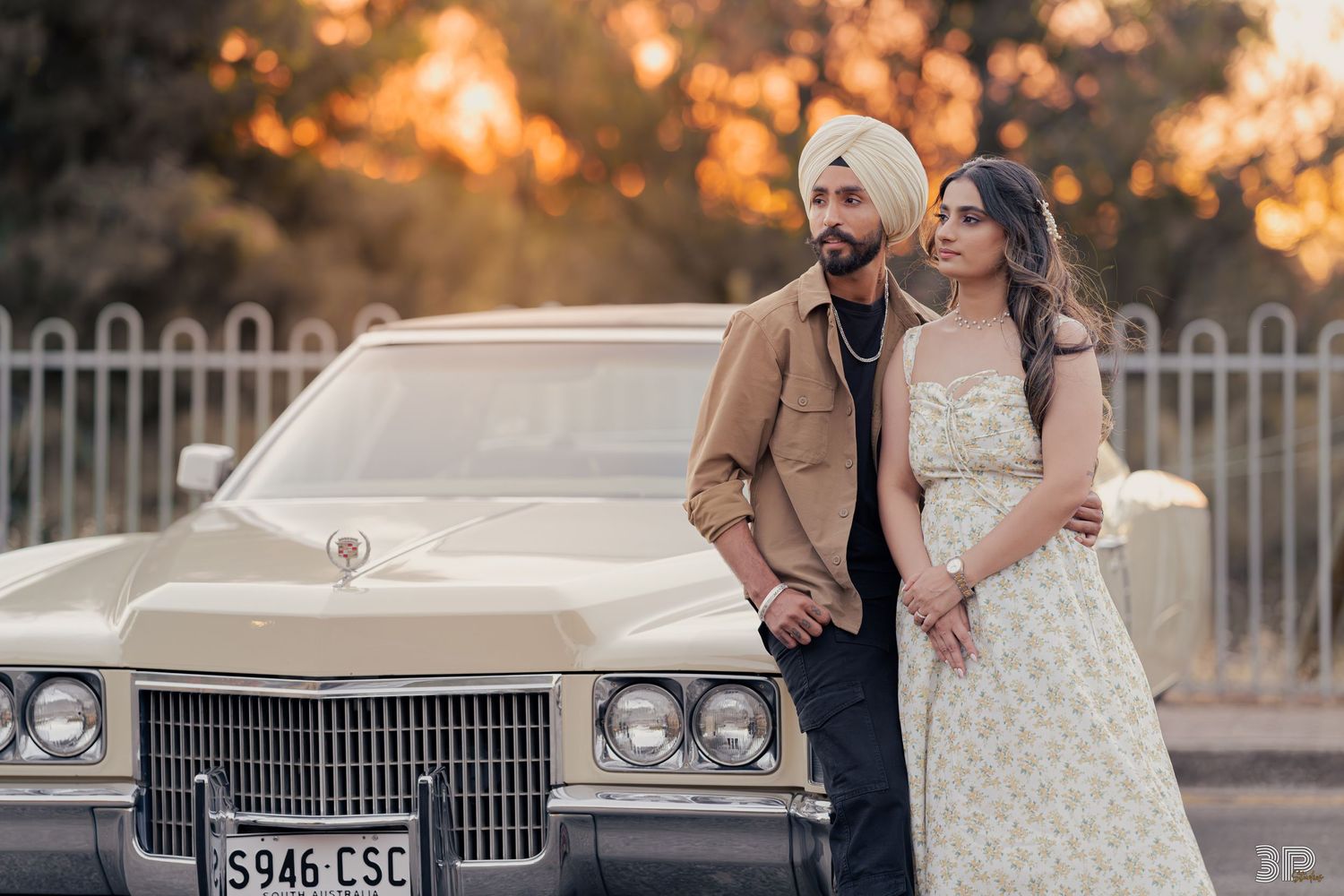 Engaged couple laughing and having fun during a playful pre-wedding photoshoot in an outdoor setting