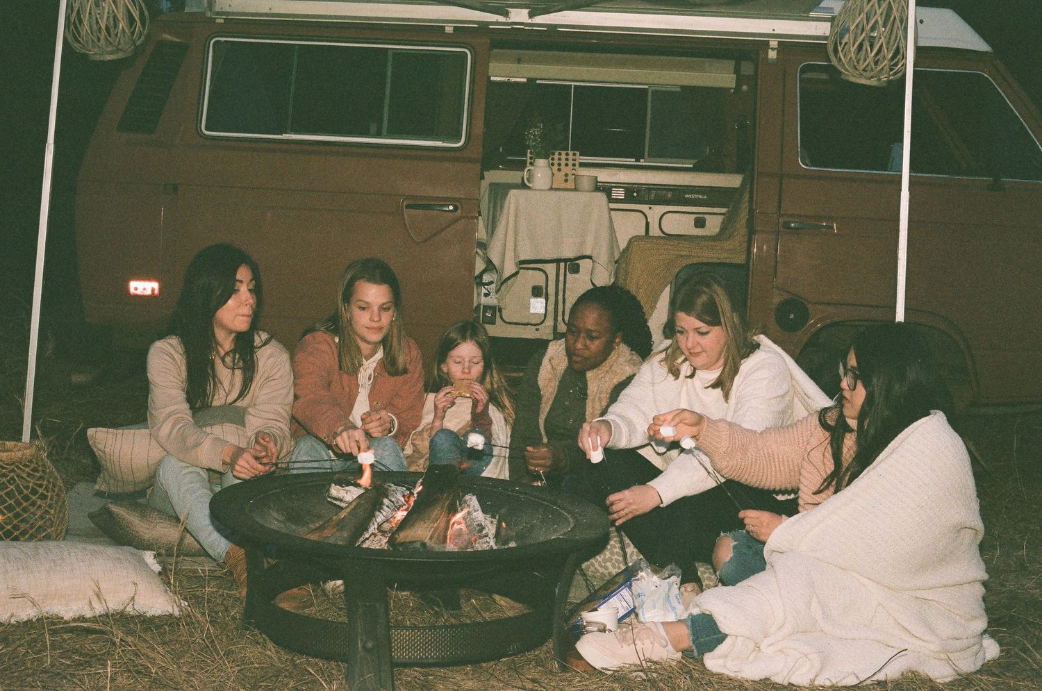 Artisan's women's event shot on film with a retro VW van