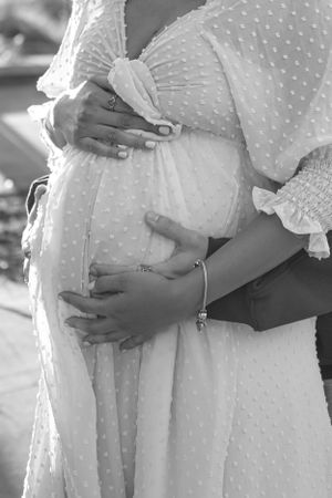 Close-up shots of a maternity dress with delicate polka dot details.