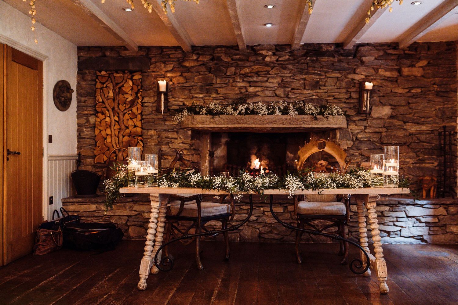 Rustic wine cellar with stone walls features wooden barrels, exposed beams, and warm lighting creating an intimate atmosphere.