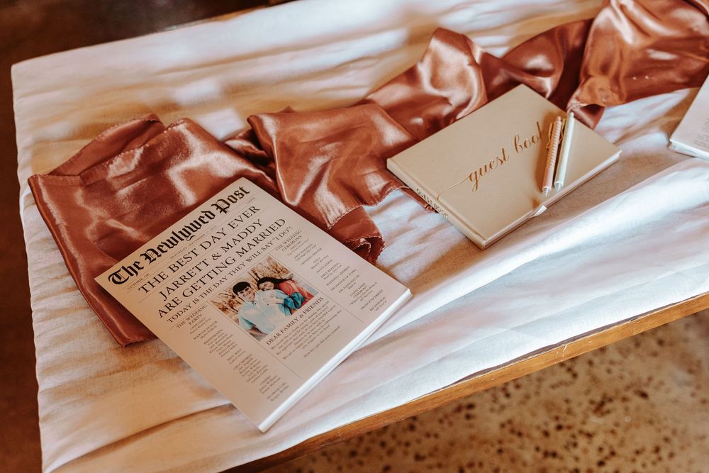 Wedding detail shot of copper-toned table decorations and place cards.