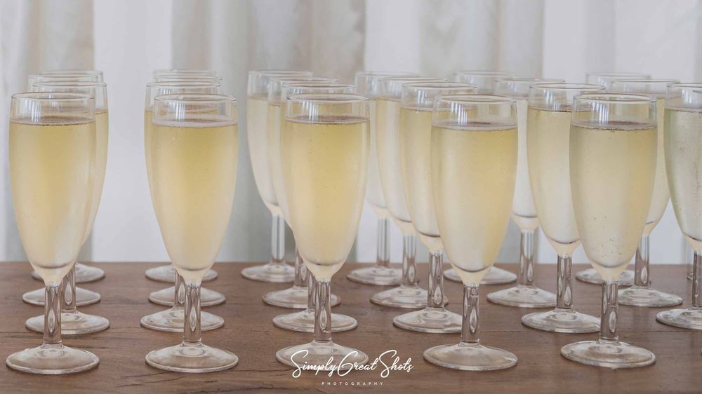 Glasses of champagne ready to celebrate the marriage of Craig and Faye at the Winters Tale Country Barn wedding venue.