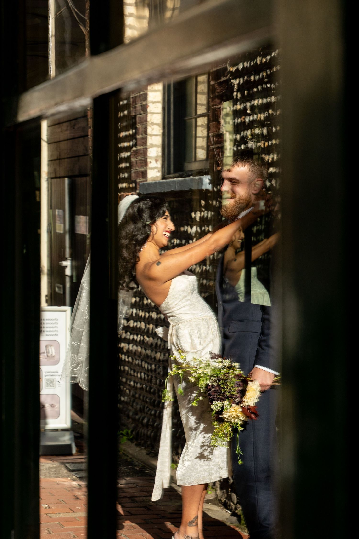 A series of candid shots through a window frame showing people interacting in a garden setting.