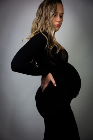 Silhouette series showing a woman in black against a grey background.