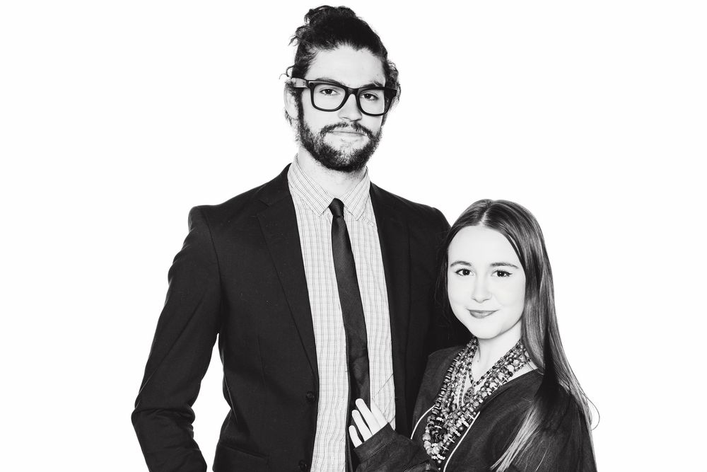 Modern business group portrait in black and white with professional styling.