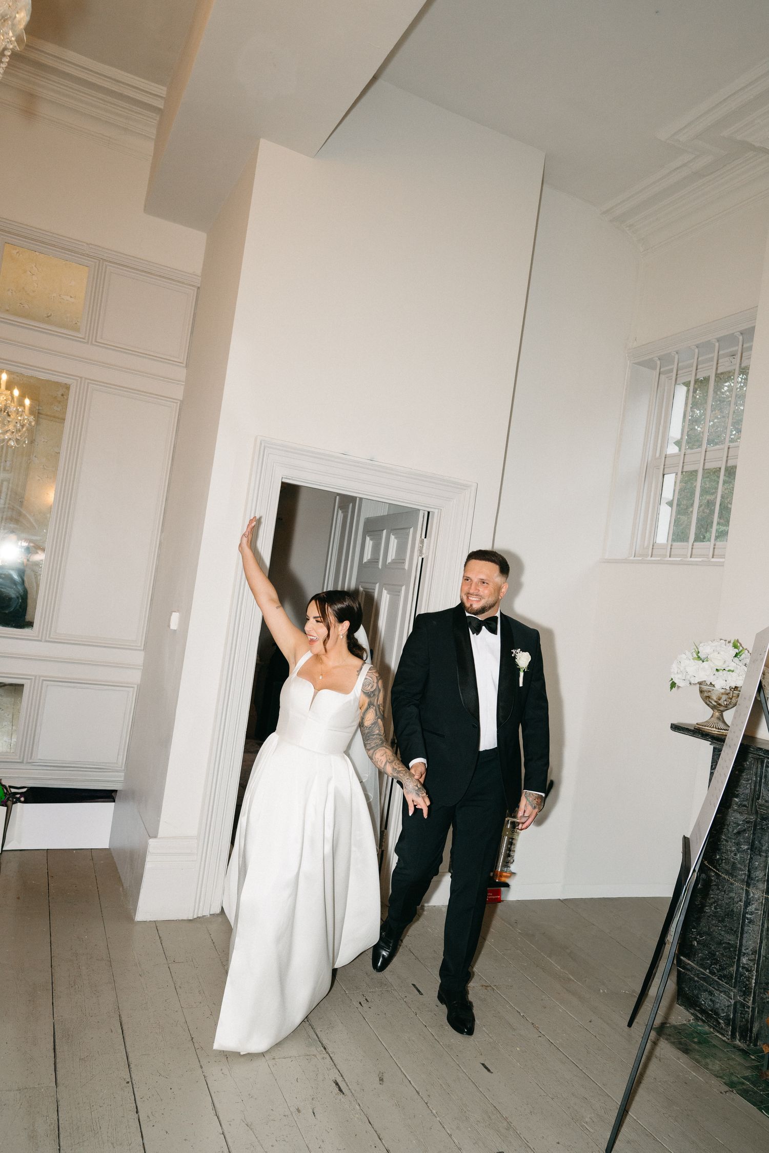A romantic black and white wedding sequence showing tender moments between a couple in front of a church's stained glass window.