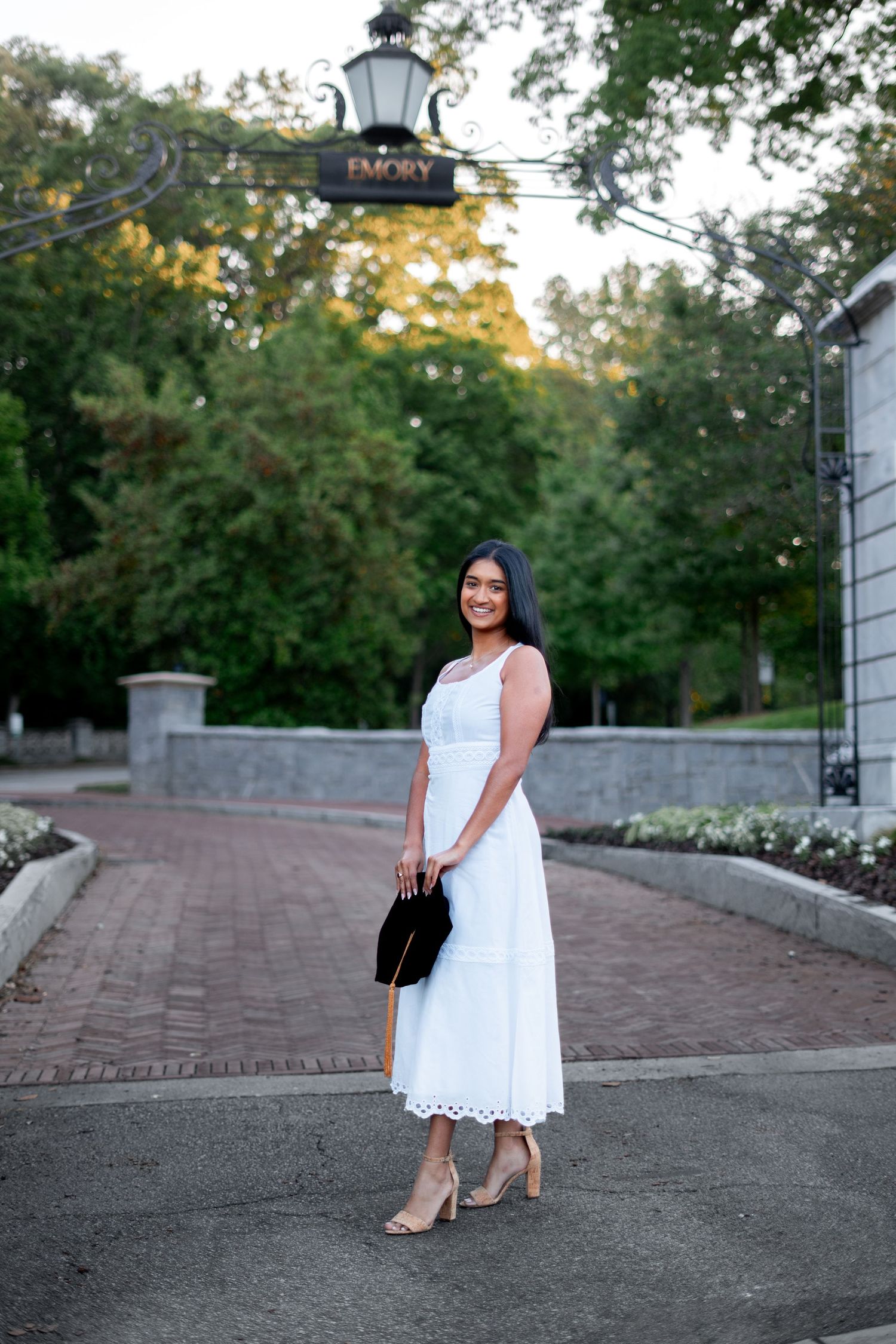 Emory graduation photos at Emory archway sign by Pierre, Atlanta Graduation Photographer