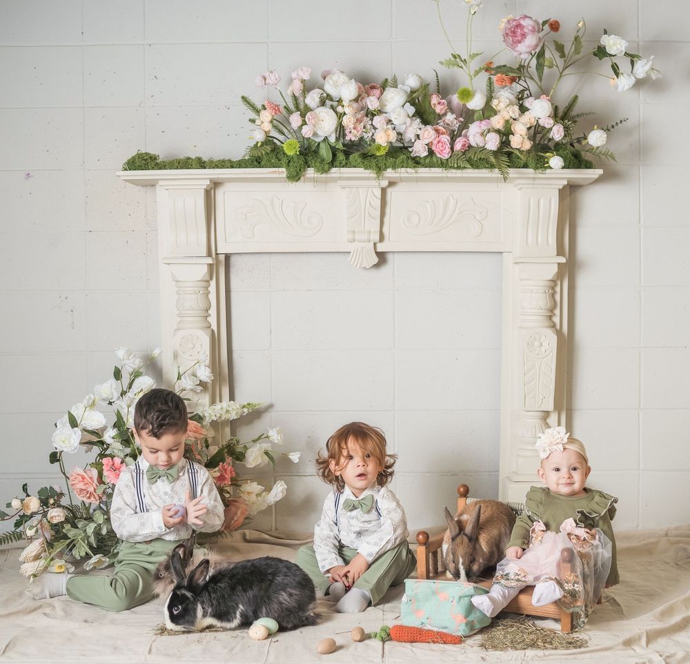Baby portrait session in rustic setting with floral decorations and vintage props arranged in six connected photos.