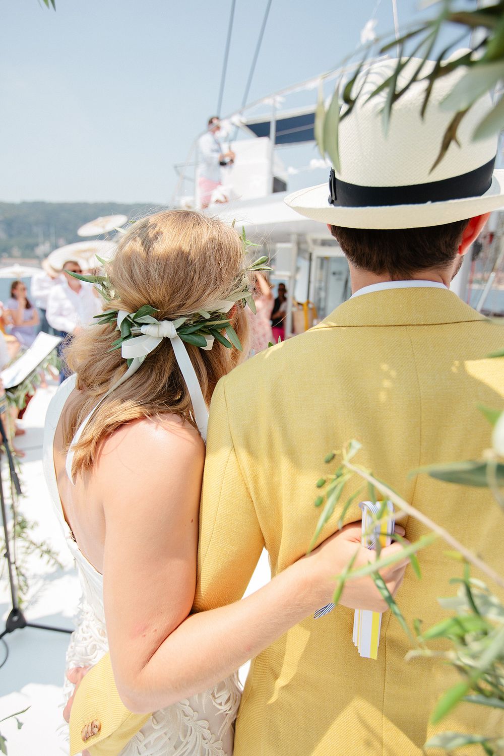 Bride and groom embracing during a catamaran wedding on the French Riviera