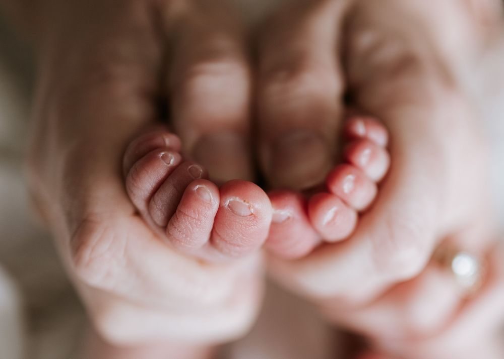 Close-up detail shots of tiny baby toes and feet.