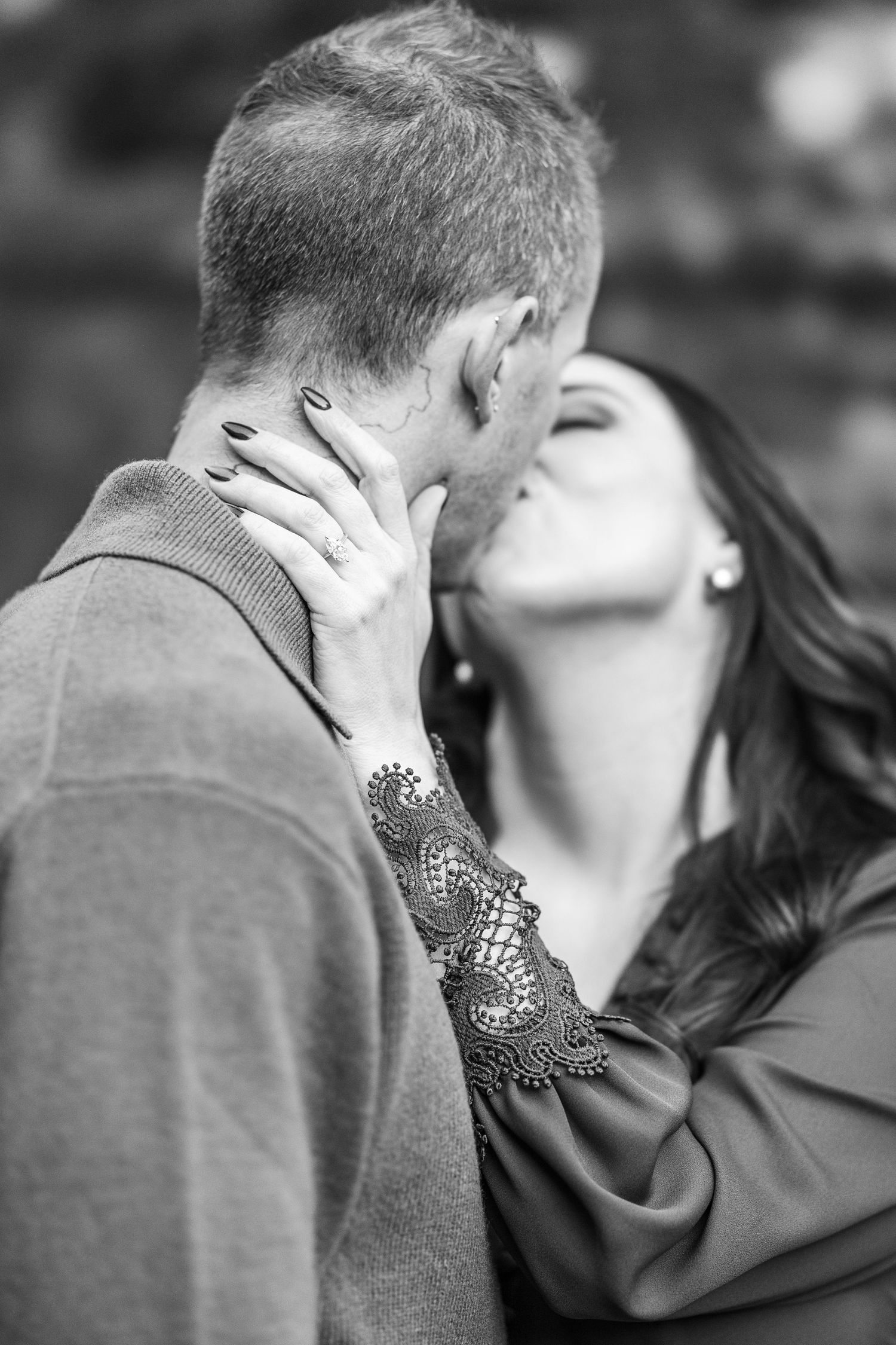 A romantic black and white photo sequence showing a couple sharing an intimate kiss.