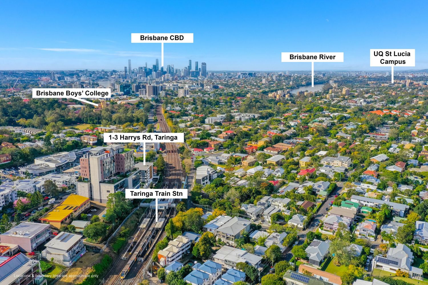 Aerial view of Taringa suburb showing train station, Brisbane CBD, Brisbane River, and UQ St Lucia campus.