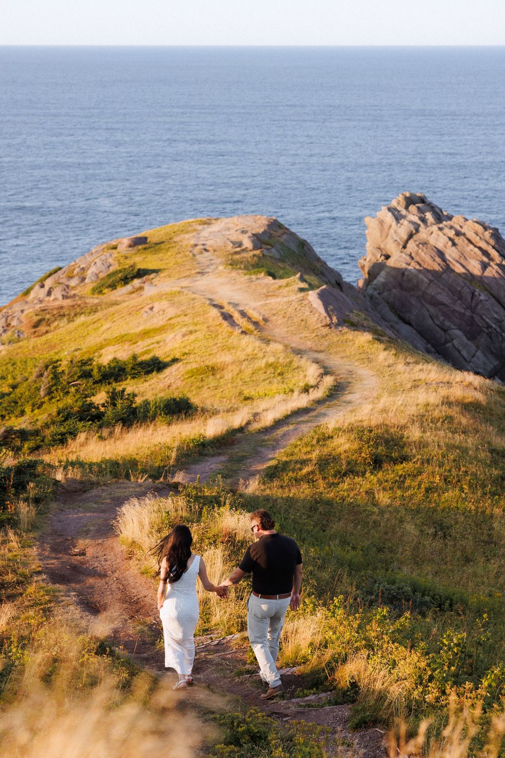 Candid engagement photos on the East Coast Trail by Newfoundland documentary style digital and film photographer Kaitlyn Yvette.