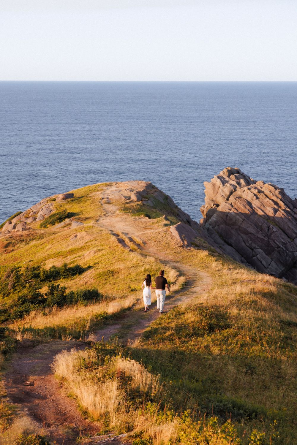 Candid engagement photos on the East Coast Trail by Newfoundland documentary style digital and film photographer Kaitlyn Yvette.