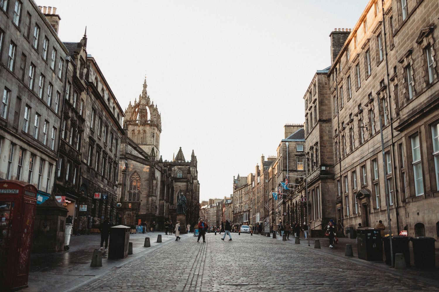 Historic buildings line the Royal Mile in Edinburgh's Old Town with its iconic cobblestone street and gothic architecture.