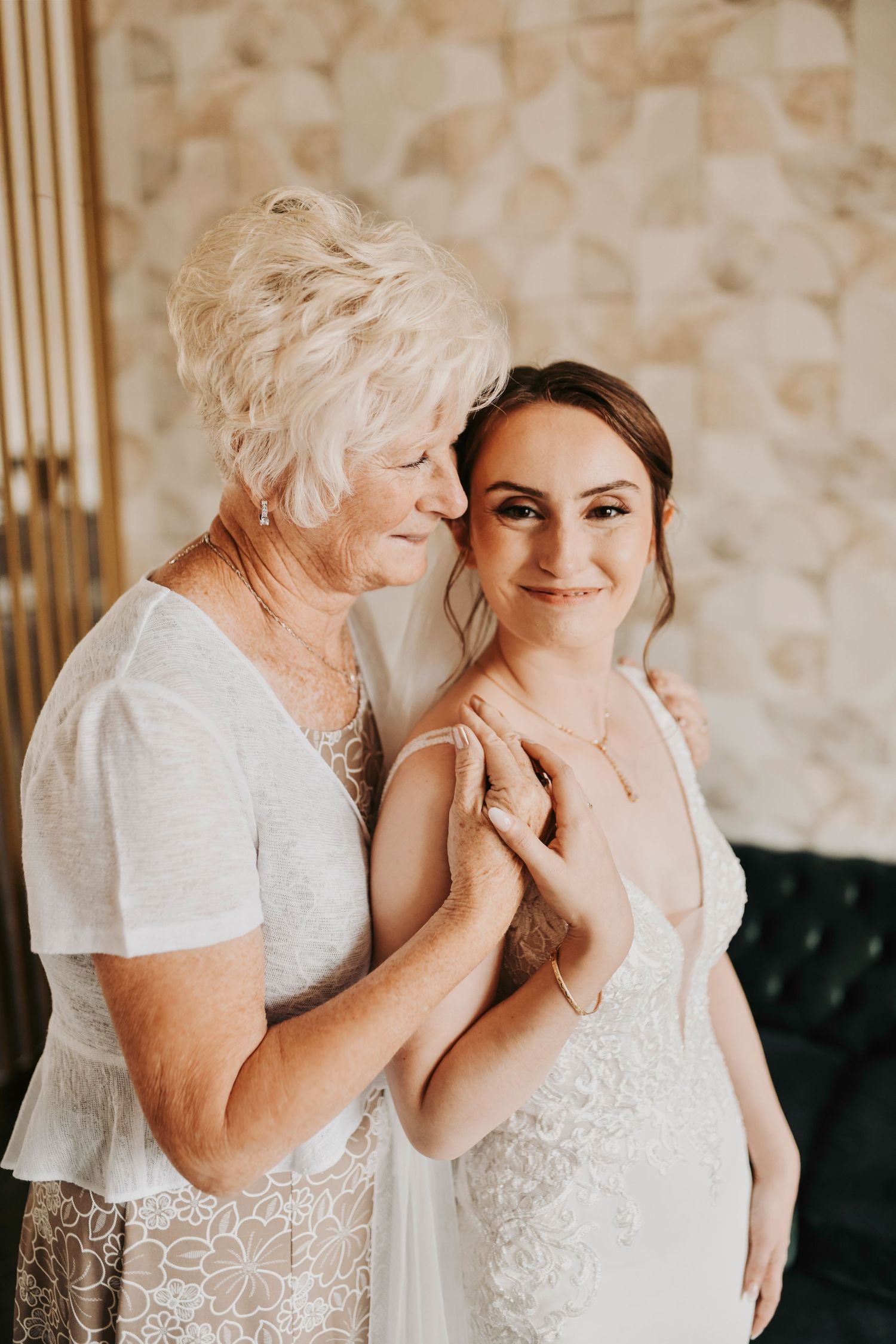 Bride posing with her grandmother during a meaningful generational wedding photo on her wedding morning in Dallas.