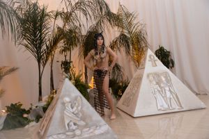 Boho style indoor scene with decorative teepees and tropical plants creating a desert oasis vibe.