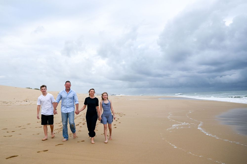 Family posing for a shoot at a beach in Port Alfred in the Eastern Cape