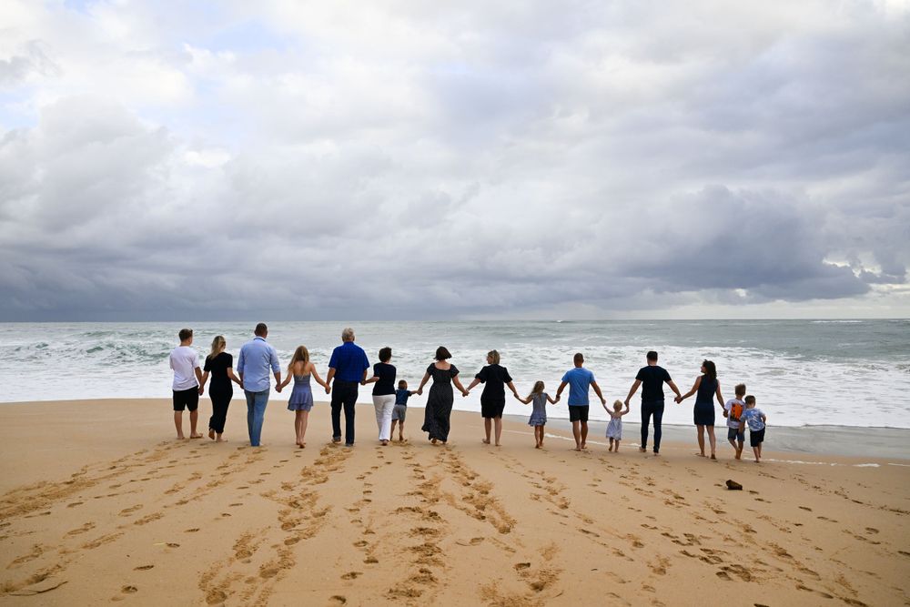 Family posing for a photo at a beach in Port Alfred in the Eastern Cape during a family photo shoot