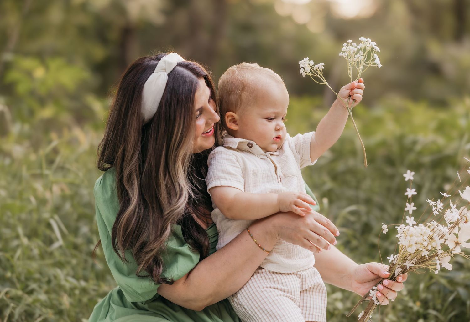 Mom and toddler sharing a joyful moment outdoors during a family photo session in Temple, TX