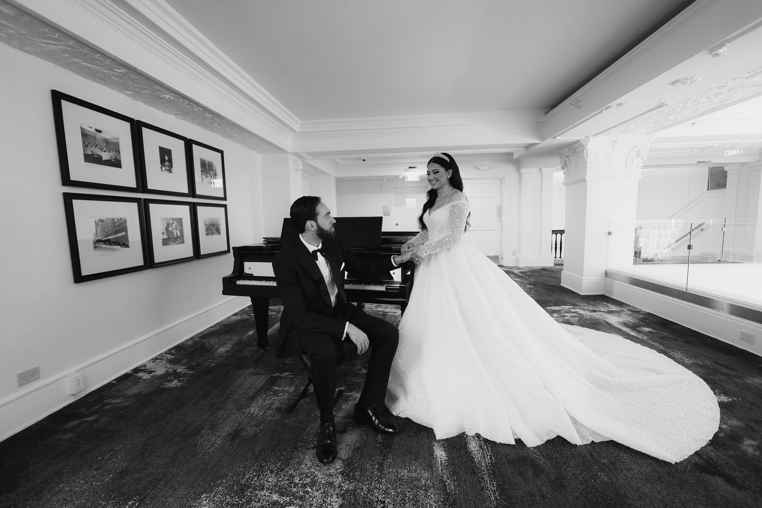 Sunset wedding portrait in open field with flowing white dress and classic black tuxedo.
