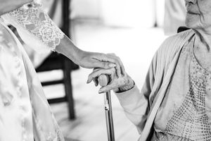 Black and white photography sequence showing intimate wedding moments.