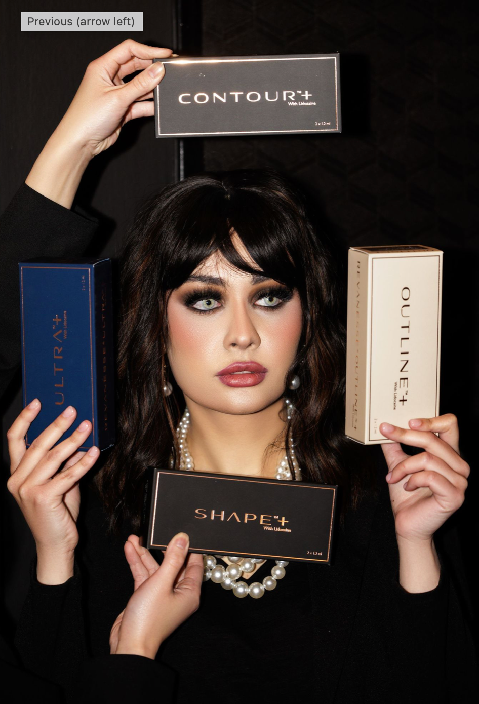 Fashion beauty shot displaying luxury makeup palettes against dark background.