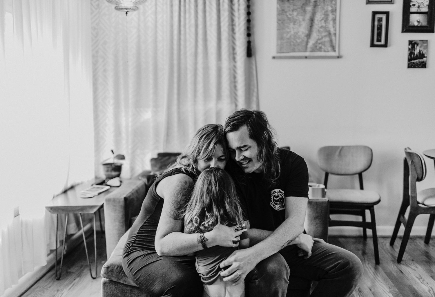 mother and father embracing child portland oregon family photographer kimberly marie kimble