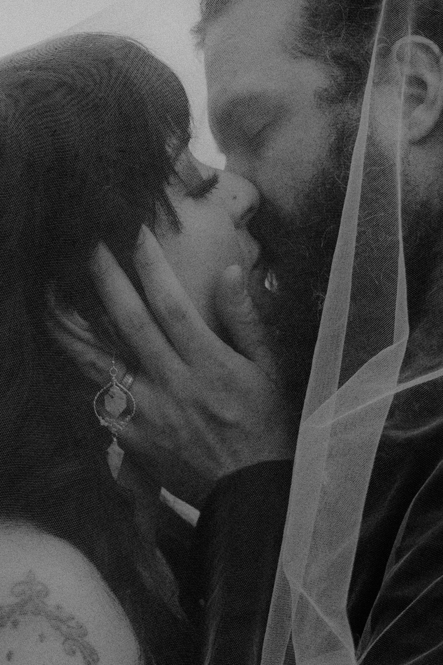Black and white romantic portrait with delicate veil details.