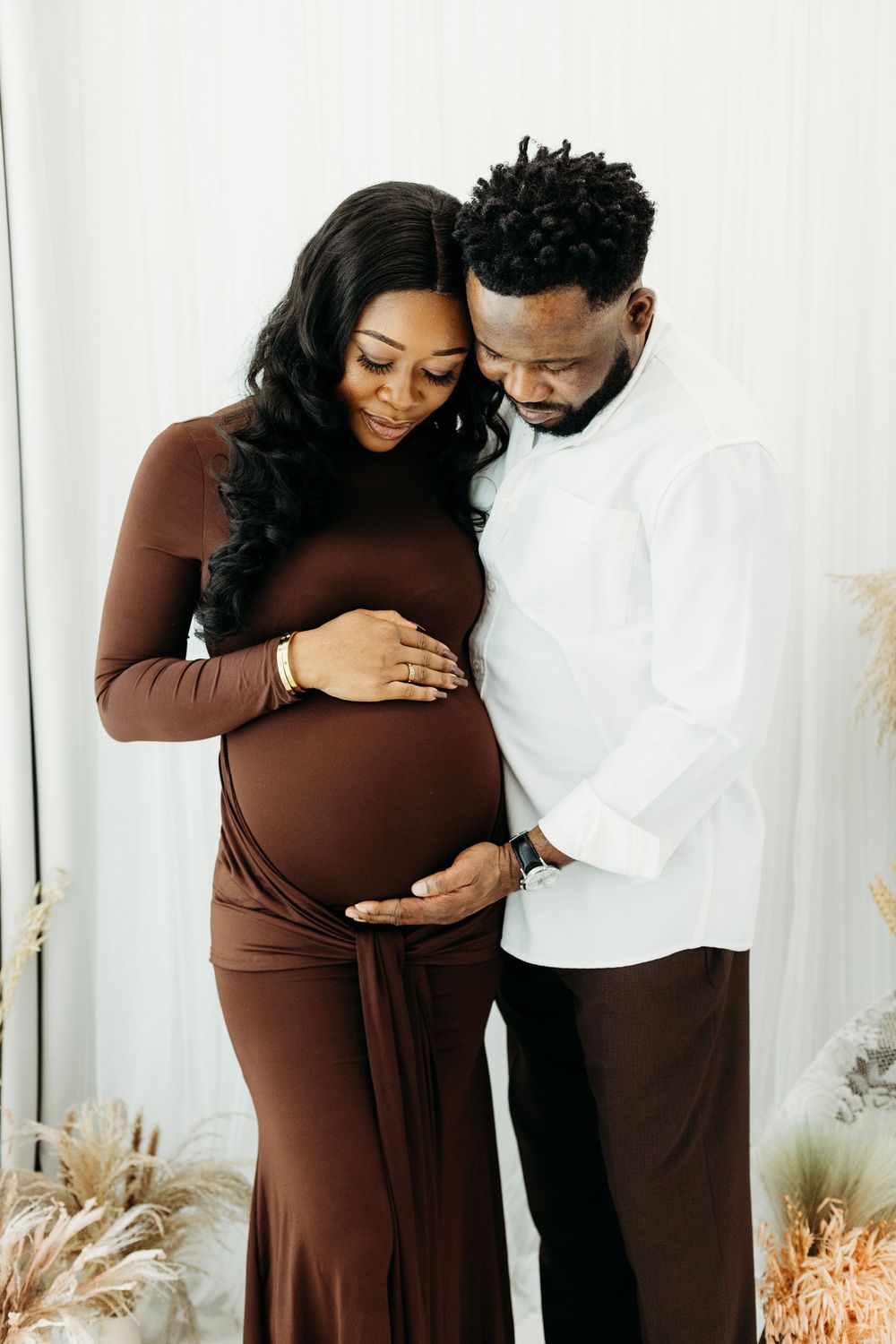 Beautiful pregnancy portrait in a minimal photography studio.