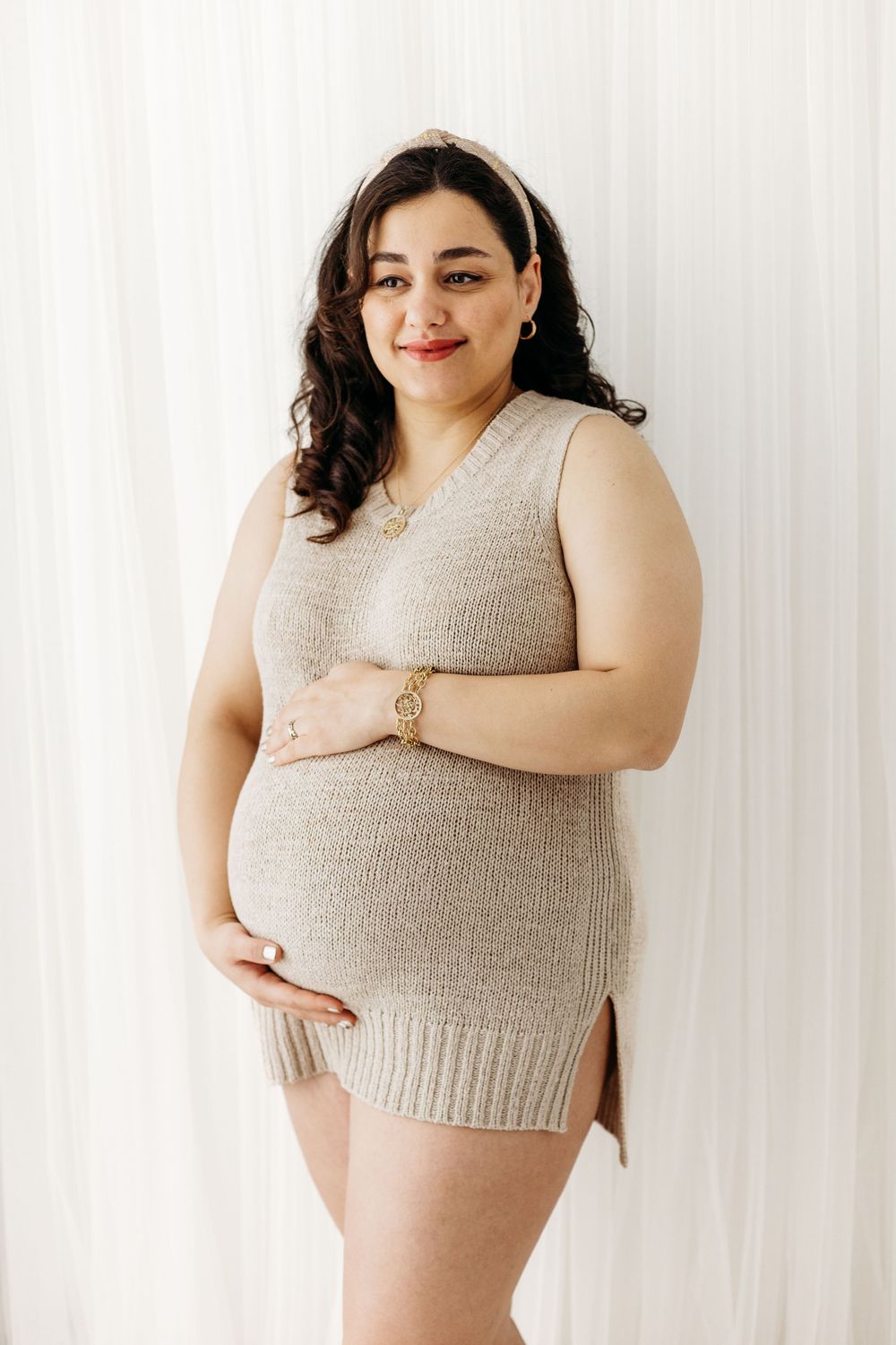 Simple maternity portrait focusing on baby bump.