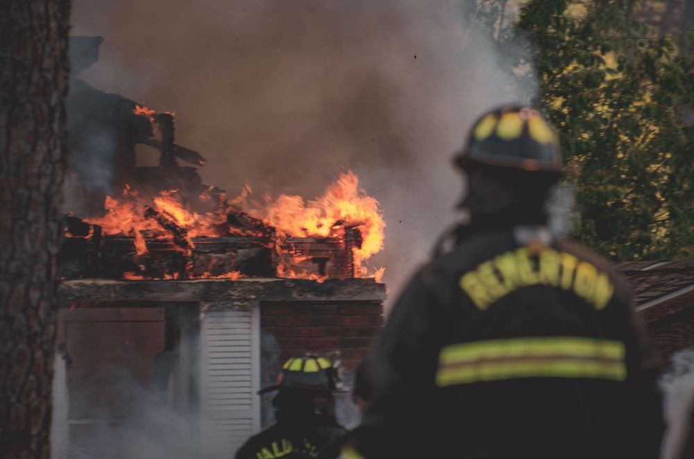 Pemberton firefighters battle a fully engulfed house fire with massive flames and smoke.