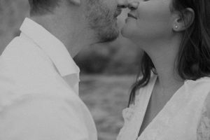 A romantic close-up moment captured at the beach.