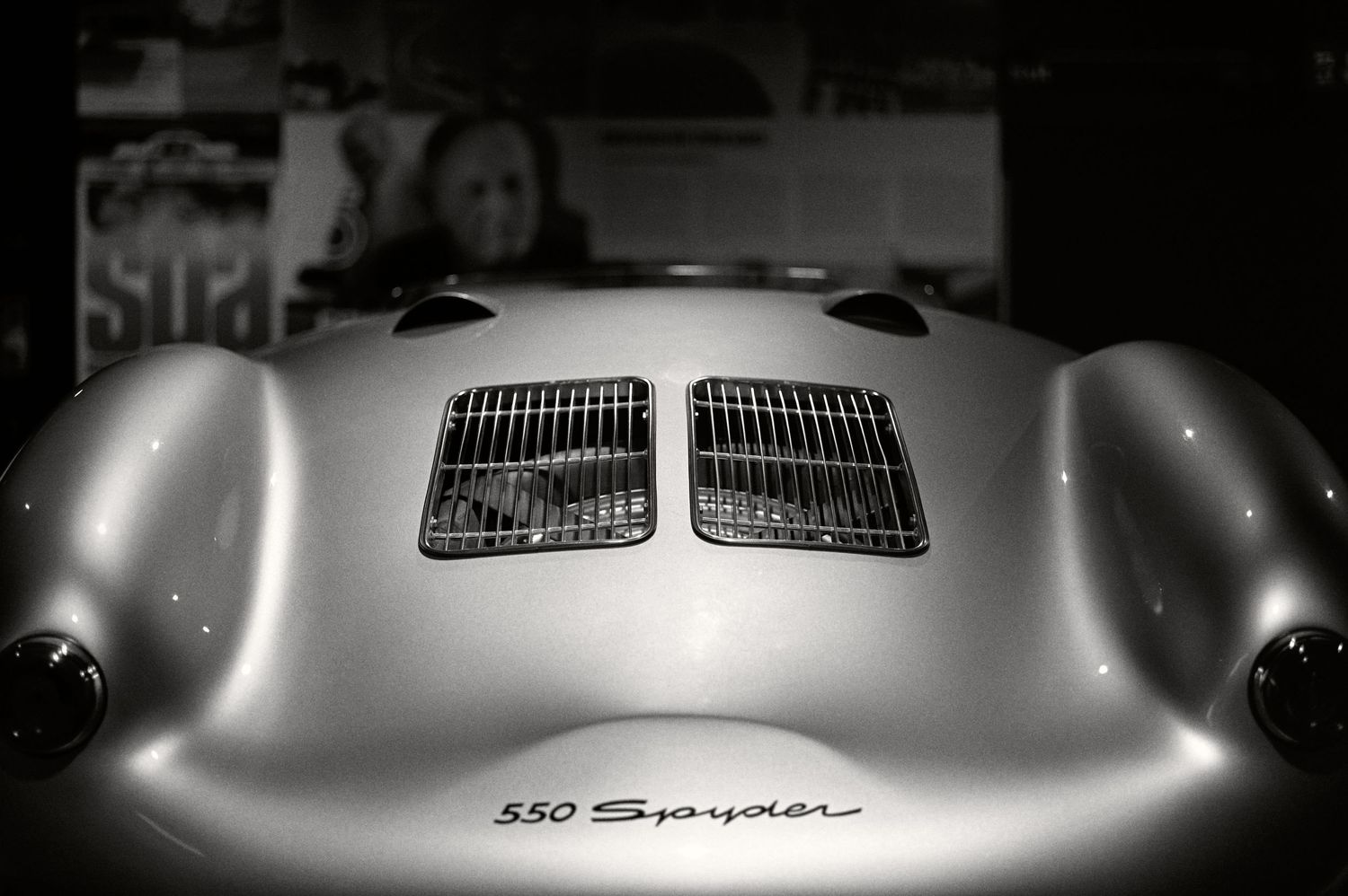 Front view of a classic Porsche 550 Spyder with distinctive hood vents.