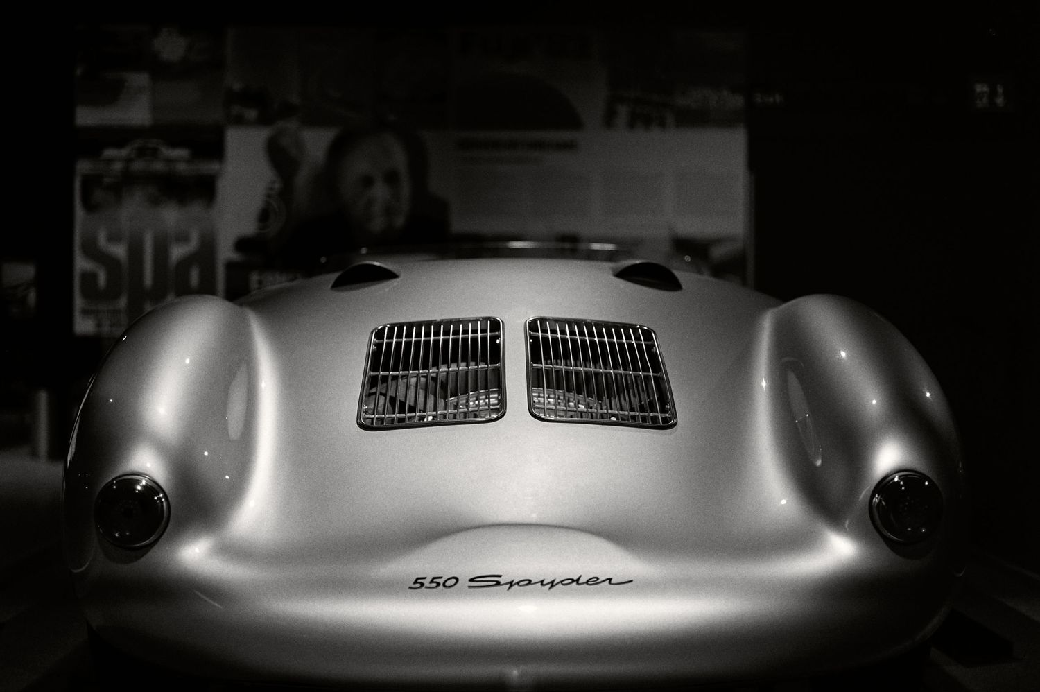 Dramatic monochrome shot of a Porsche 550 Spyder's front hood and vents.