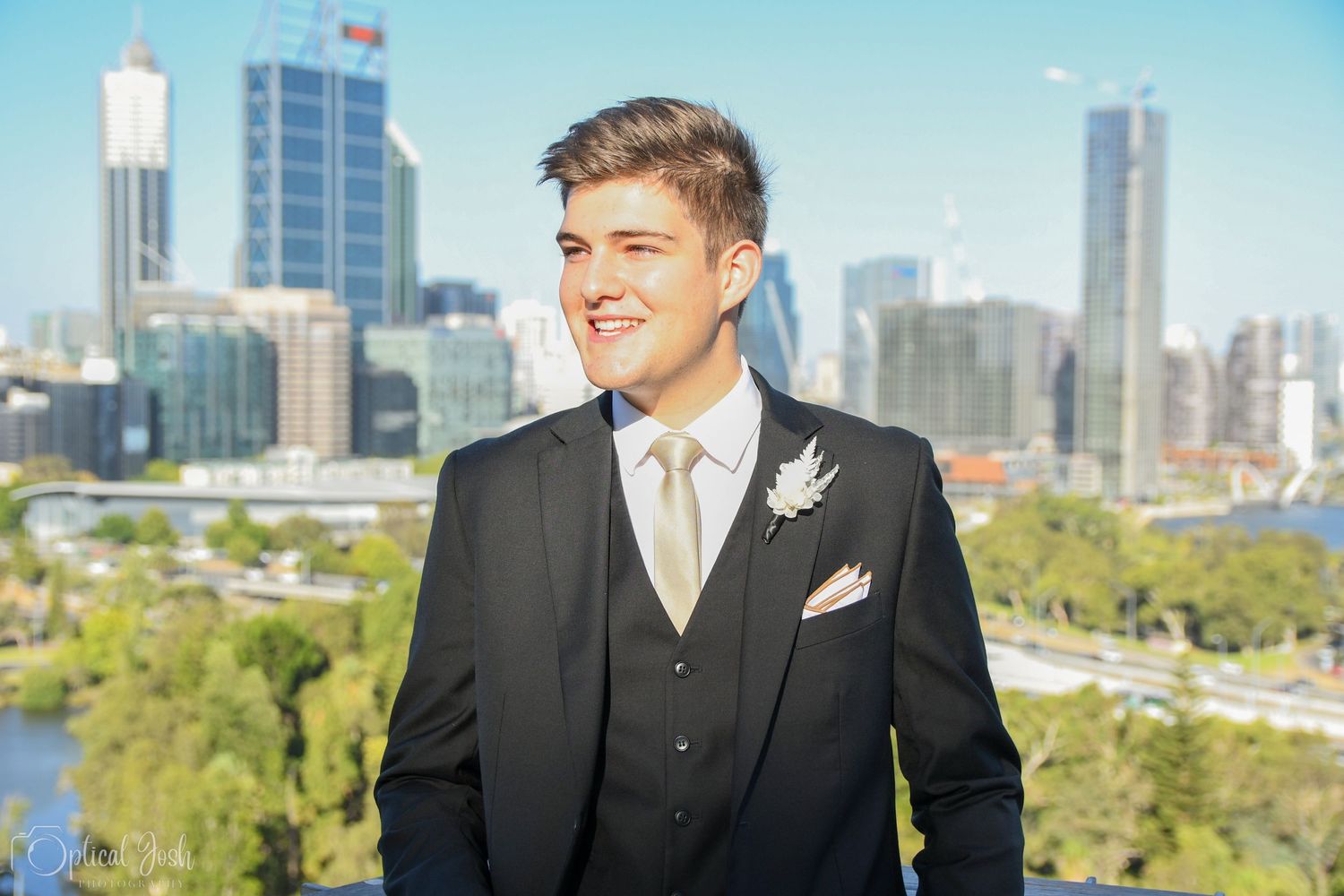 Formal portrait with Perth city skyline and Kings Park in the background on a sunny day. (Optical Josh)