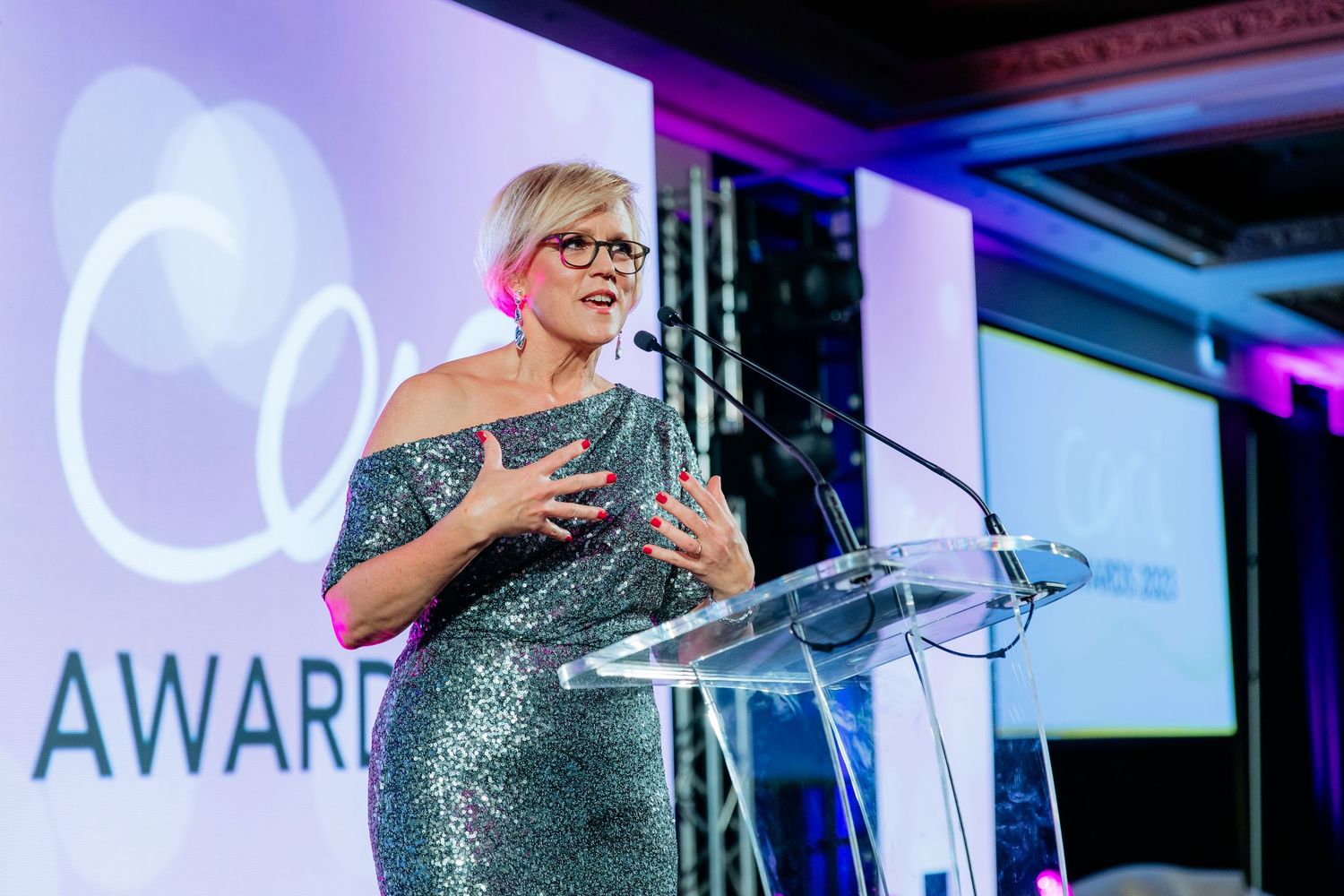 Corporate event photography in Auckland showing guest speaker on stage talking to audience