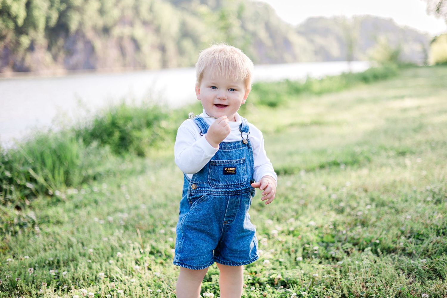 Image of child in an open field in the Spring time by Sarah Smith Photos Knoxville, Tennessee Photographer.