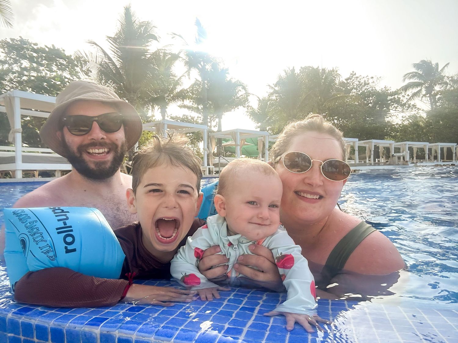 Fun pool selfies showing joyful moments in bright blue water.