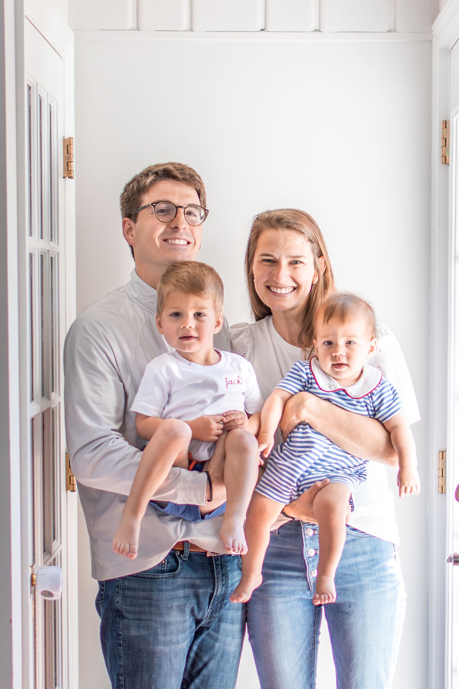 A Winston-Salem family plays together in a light-filled alcove in their home.