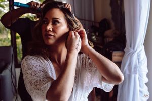 Getting ready scene with white lace details and elegant wedding preparations, Papaya Playa Tulum Wedding.