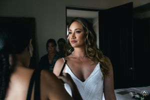 Intimate wedding preparation moments in a softly lit room, Papaya Playa Tulum Wedding.