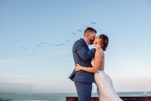 Romantic seaside wedding portrait with birds flying in background during sunset, Papaya Playa Tulum Wedding.