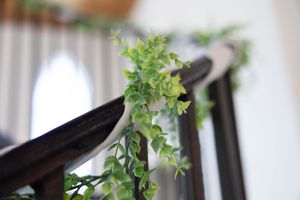 Elegant greenery and floral decorations adorning a wedding venue interior.