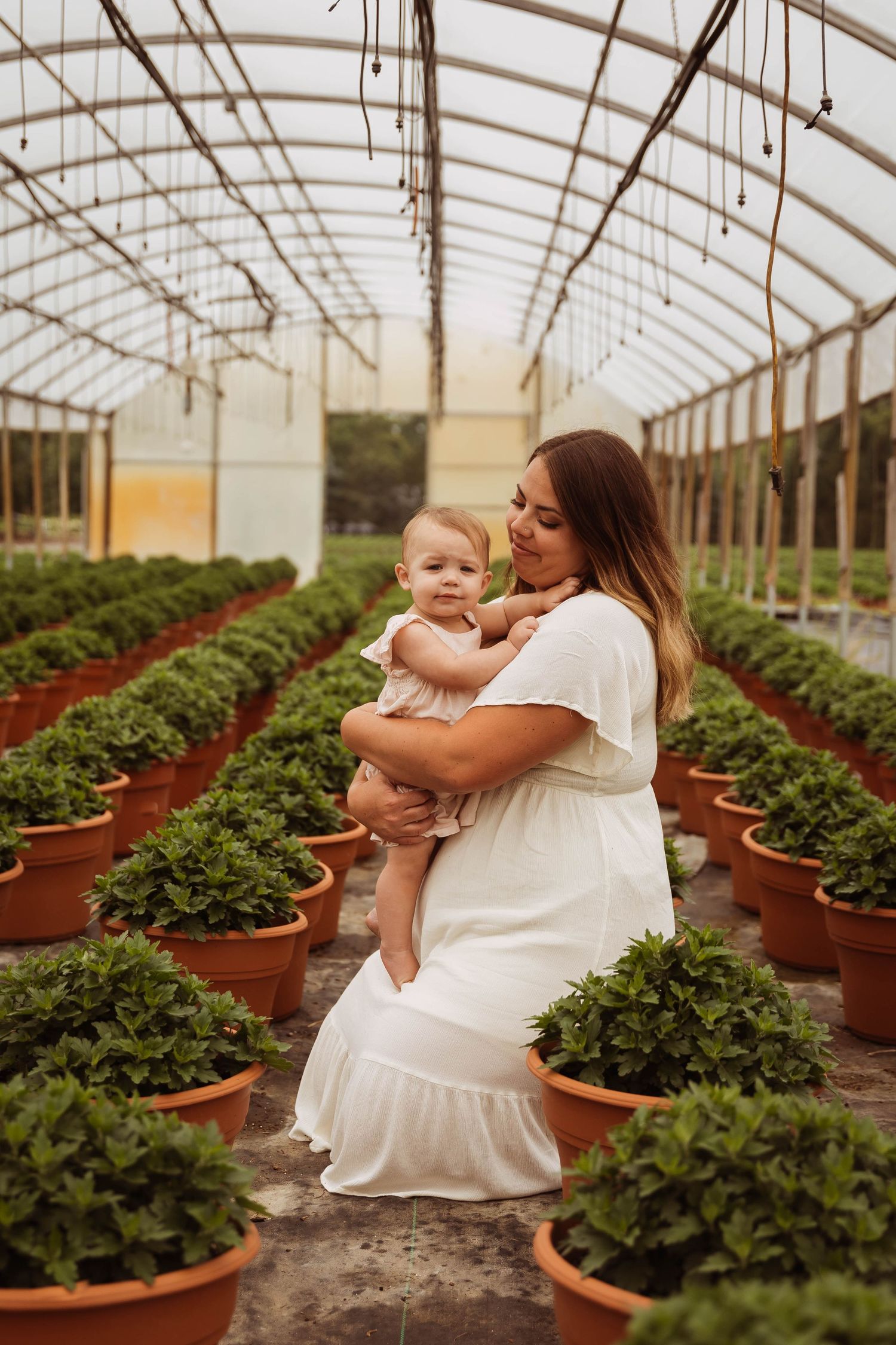 Family greenhouse portrait taken by Elle & Co. Photography in Southeast Michigan